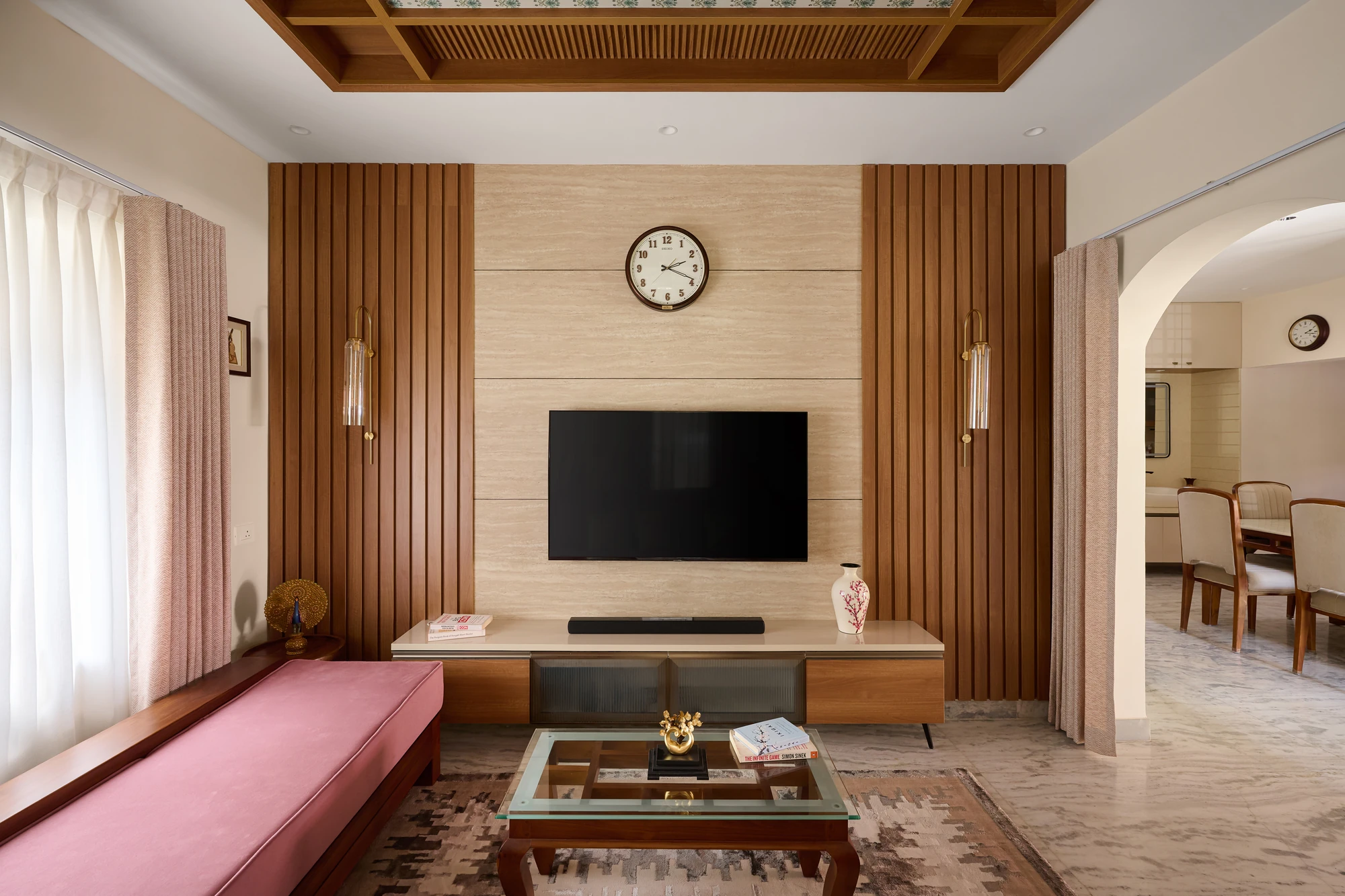 Living room with fluted TV wall and daybed by Space Decor